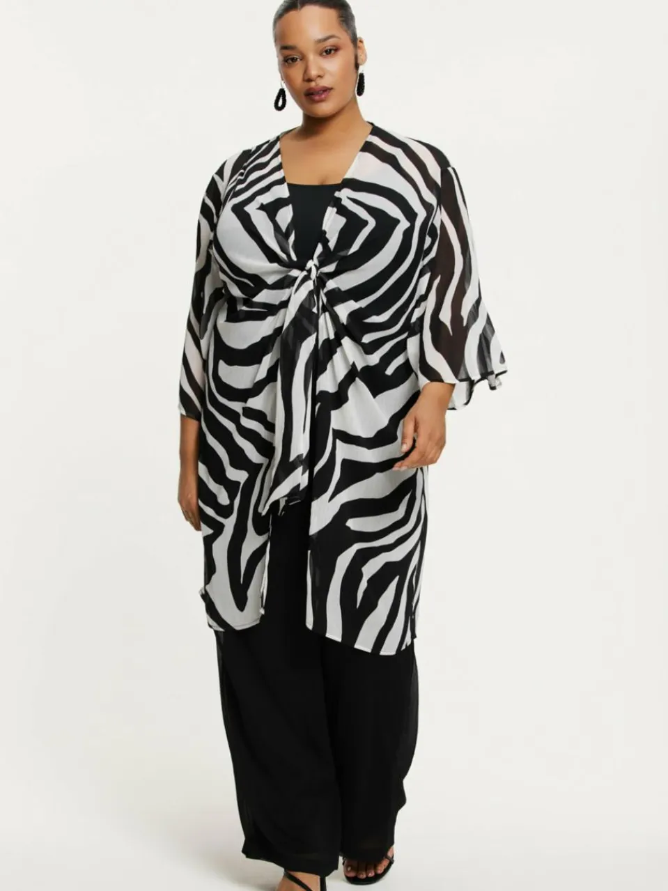 YOEK Blusen<Damen Strickjacke schwarz bedruckt